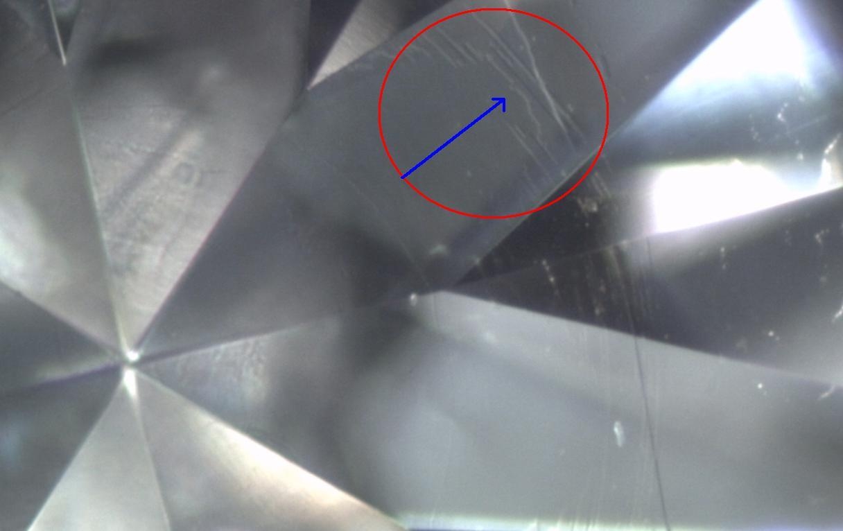 A burn mark on a diamond facet