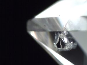 Small black graphite inclusions in a diamond.