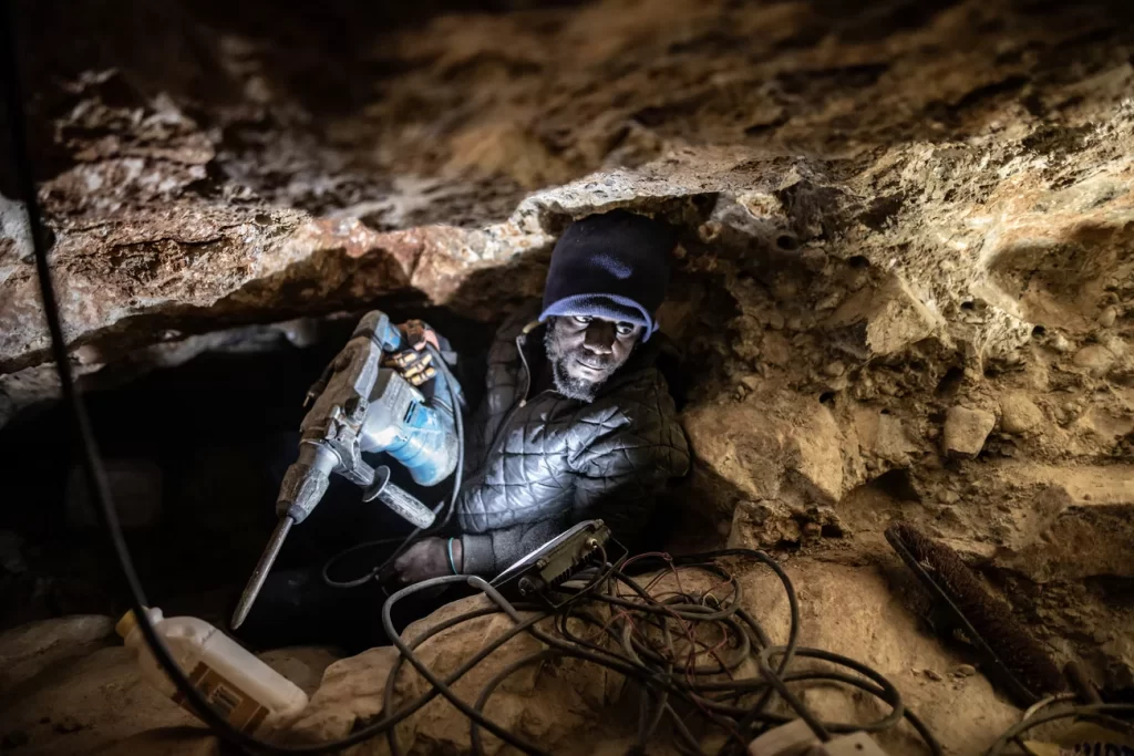 Jefferson Ncube, an illegal diamond miner from Zimbabwe, works on his latest tunnel at an abandoned De Beers mine near Kleinzee, South Africa.