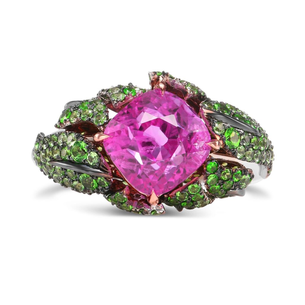 
A Leibish custom made ring bearing a 5.43-carat Mogok vivid-pink sapphire and green tsavorite. 