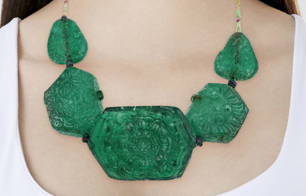 A 275-year-old carved emerald necklace from the Mughal Empire sold for $6.2m, more than double its high estimate, at Christie's New York.