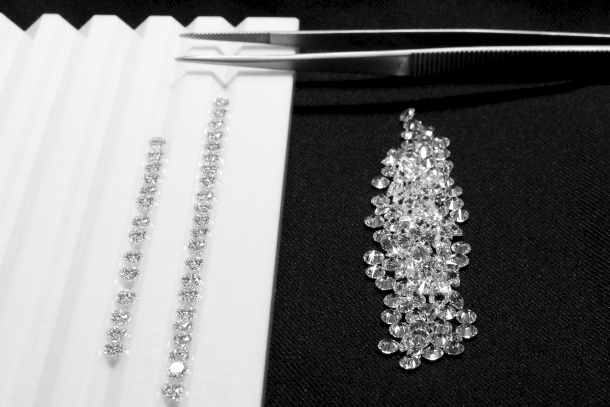 Diamonds and Tweezers diamond on black background