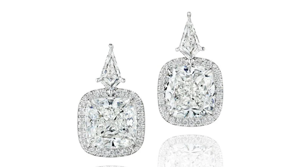 A pair of earrings, each sporting a cushion-cut, 5.01-carat, E, VS1 diamond