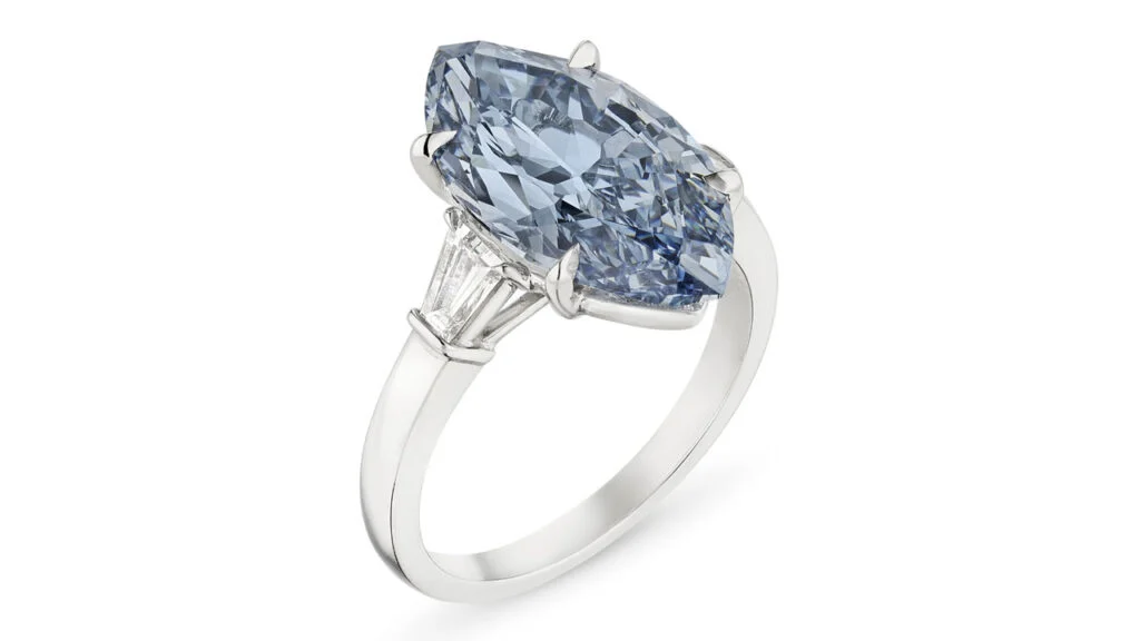 A ring bearing a marquise modified brilliant-cut, 5.04-carat, fancy-vivid-blue, VVS2